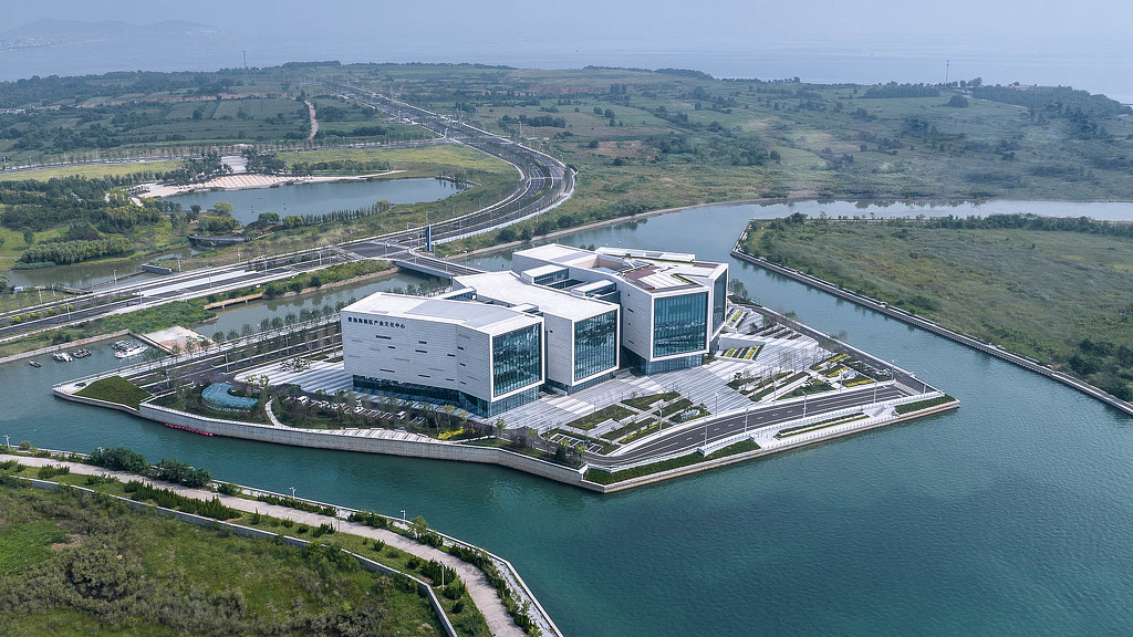 High angle shot of a building surrounded by water